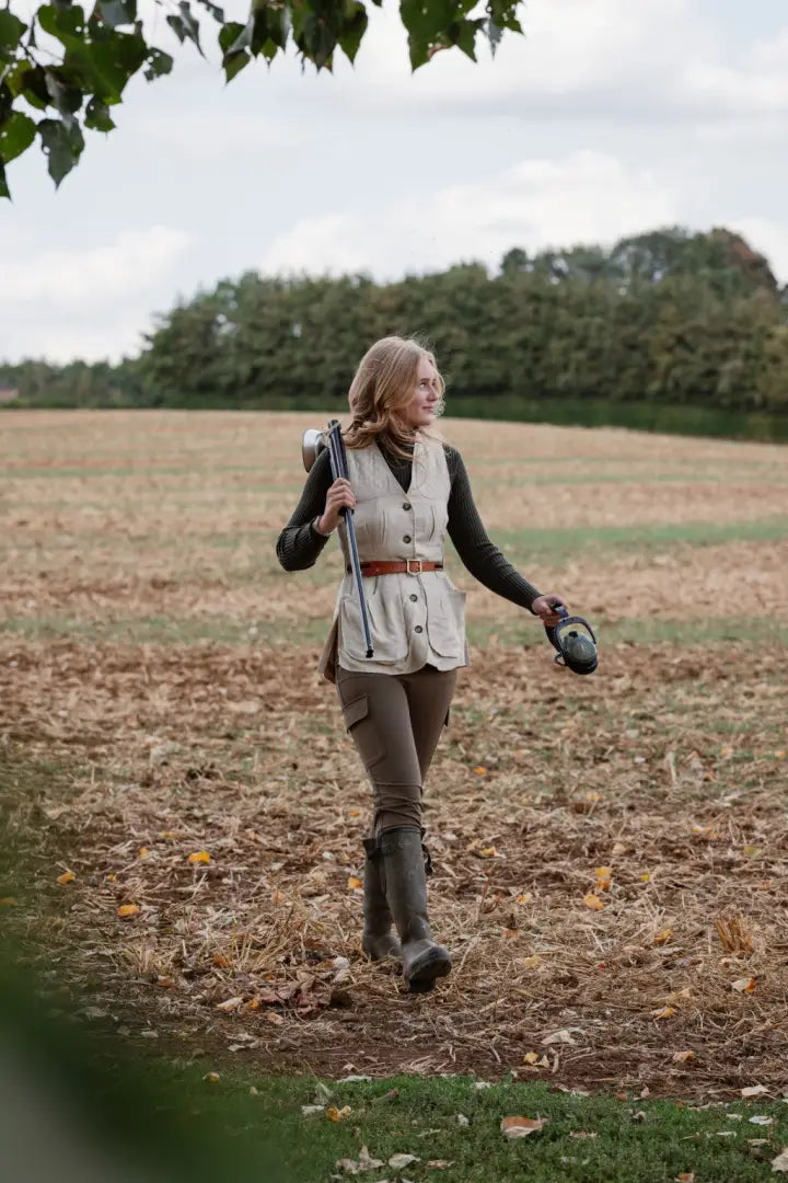 Forest ladies outdoor outfit with outdoor stretch trousers, vest, rifle, and boots