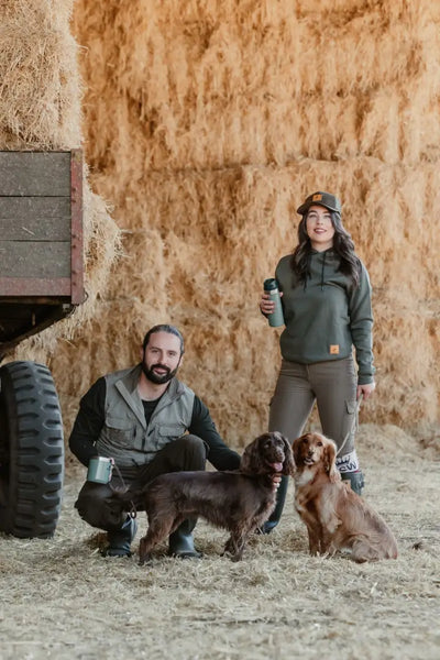Rural couple with dogs wearing New Forest Ladies Outdoor Stretch Trousers outdoors in forest