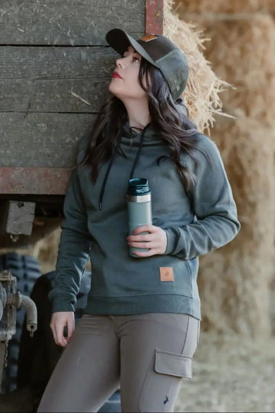Woman in green hoodie and cap wearing New Forest Ladies Outdoor Stretch Trousers