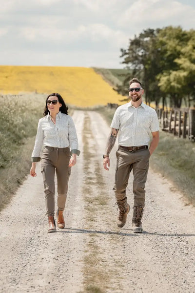 Couple walking on dirt road wearing New Forest Ladies Outdoor Stretch Trousers