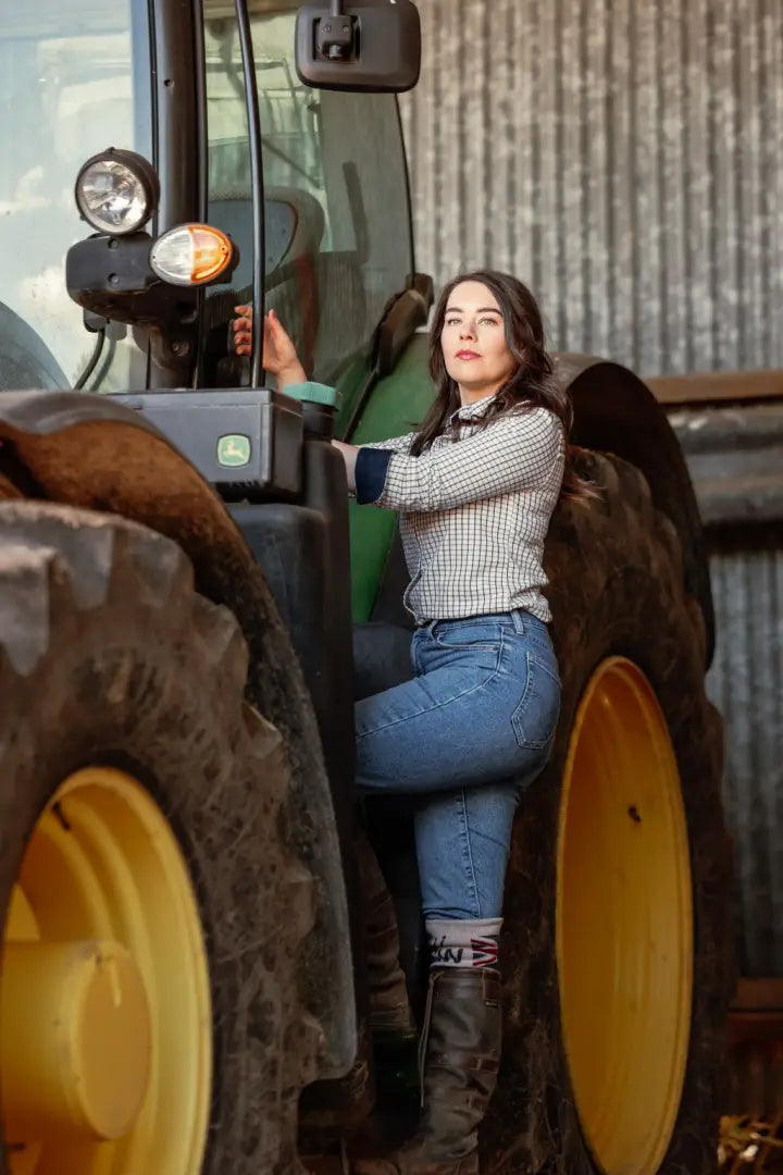 Woman climbing a tractor in the New Forest Ladies Premium Tattersall Shirt, favorite country shirt