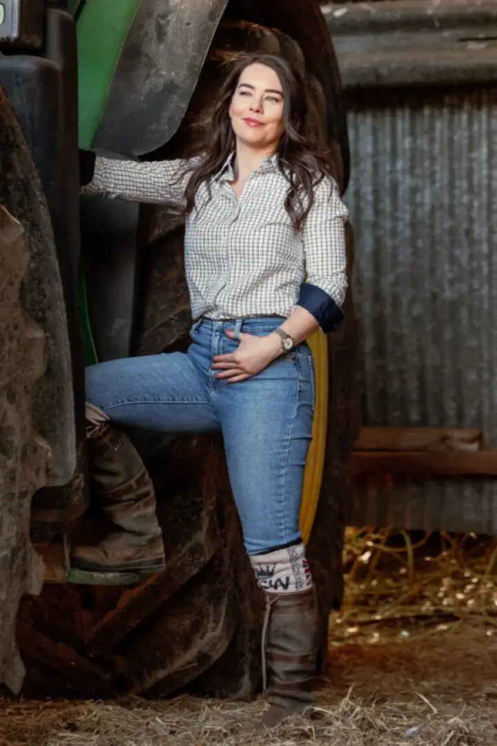 Woman posing with tractor in New Forest Ladies Premium Tattersall Shirt, your fave country shirt