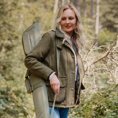 New Forest Ladies waterproof tweed jacket in olive green wool with black buttons and Barbour logo