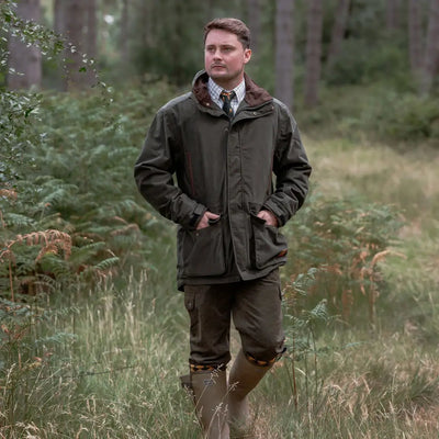 Man in outdoor clothing wearing the New Forest Marsh Jacket, perfect for forest marsh adventures