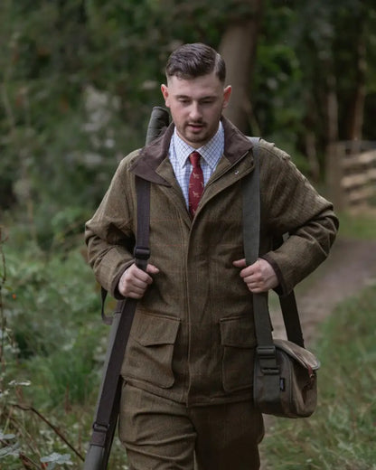 Man wearing New Forest Maverick Waterproof Tweed Breeks and shooting jacket