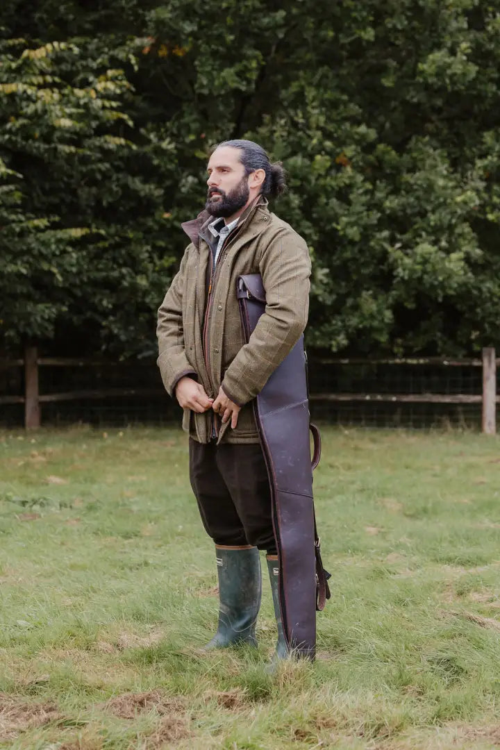 Man in hunting attire wearing New Forest Maverick advanced tweed jacket outdoors
