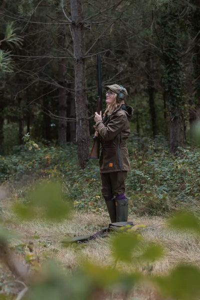 Young woman in hunting attire wearing the New Forest Maverick waterproof tweed jacket