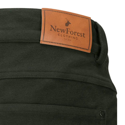 Dark green Forest Moleskin Jeans with a brown leather label perfect for casual style