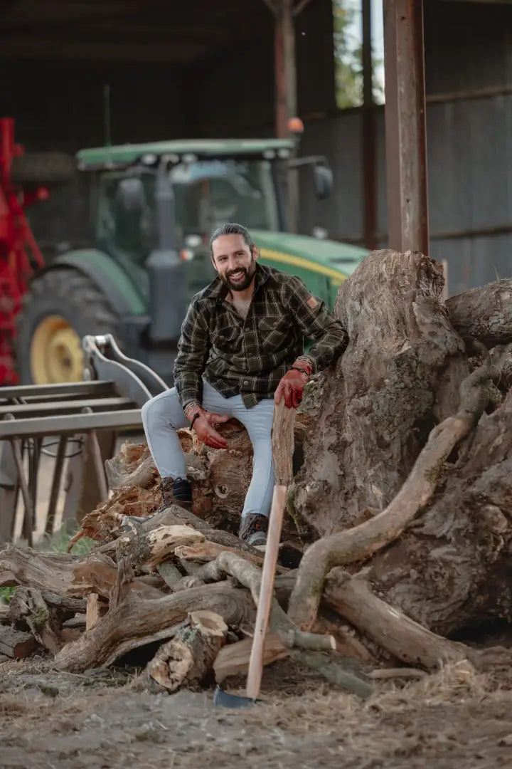 Bearded man with axe wearing New Forest Padded Shirt, expertly made padded shirt for outdoors