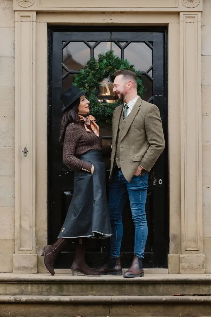 Couple showing off style in front of door wearing New Forest Premium Wool Tweed Blazer