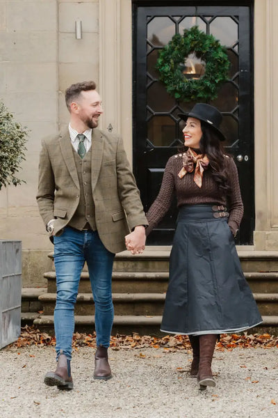 Couple holding hands, showcasing the stylish New Forest Wool Tweed Waistcoat