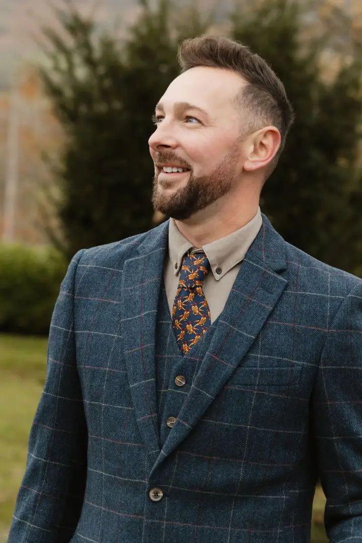 Man in a blue plaid suit showcasing the New Forest Premium 100% Wool Tweed Waistcoat