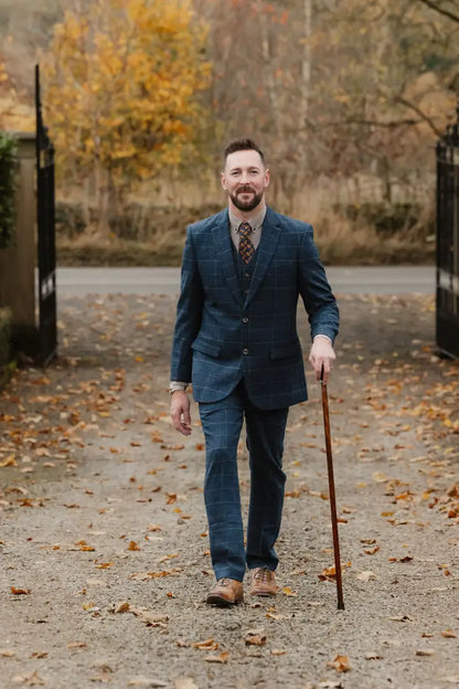 Man in a blue plaid suit showcasing New Forest Premium 100% Wool Tweed Waistcoat features