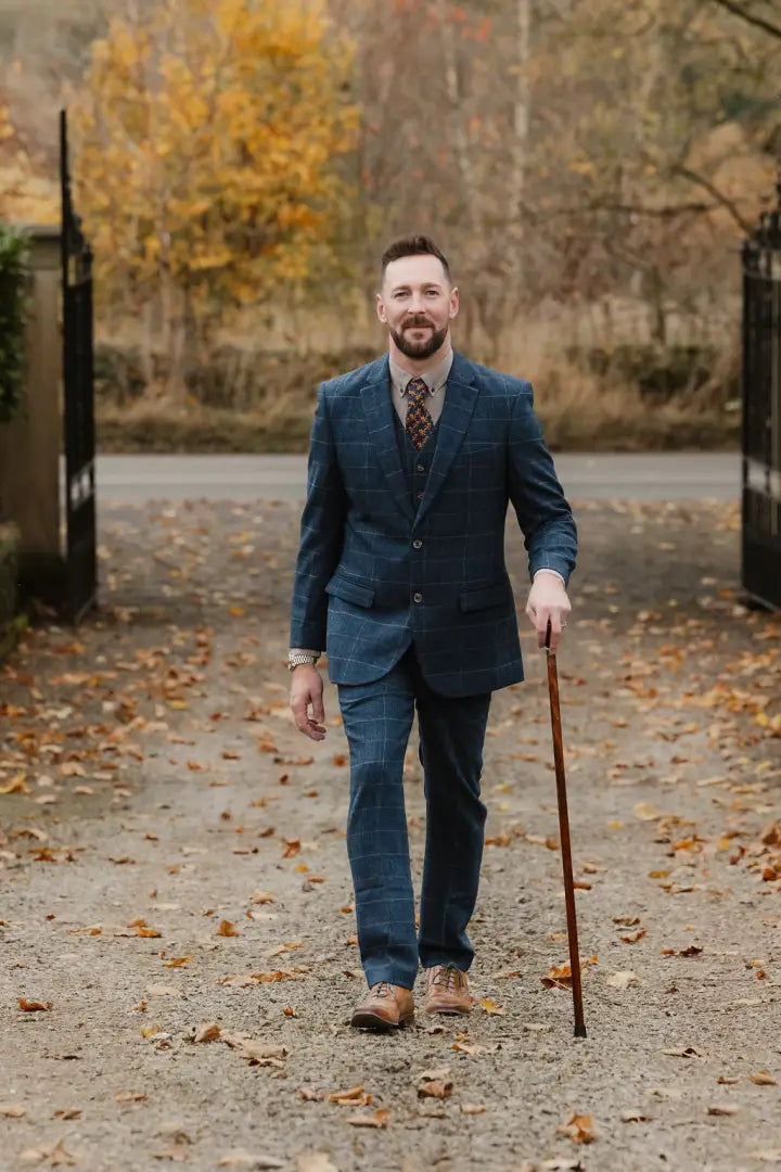 Man in a blue plaid suit showcasing New Forest Premium 100% Wool Tweed Waistcoat features