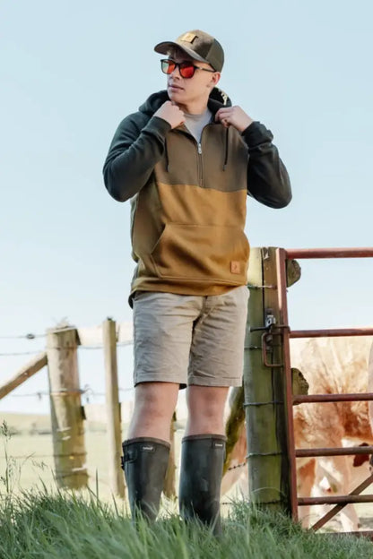 Man in outdoor attire wearing the New Forest Raptor Hoodie, perfect for forest raptor lovers