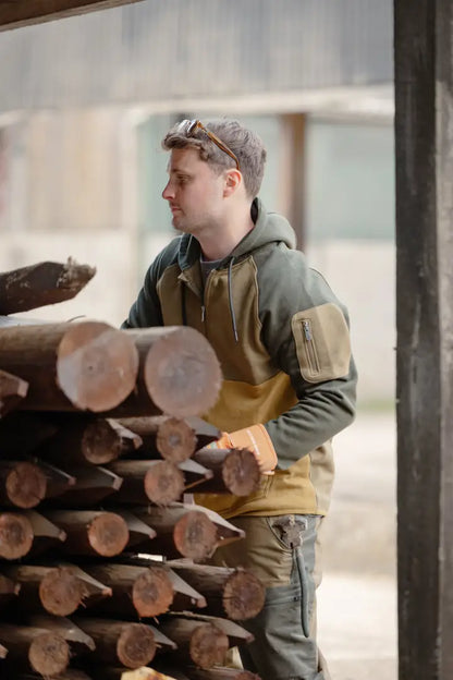 Stacked wooden posts on New Forest Raptor Hoodie for that forest raptor vibe