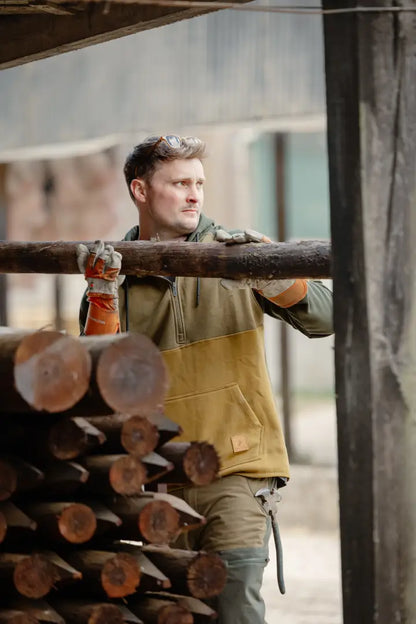 Man in work clothes wearing the New Forest Raptor Hoodie, perfect for outdoor raptor lovers