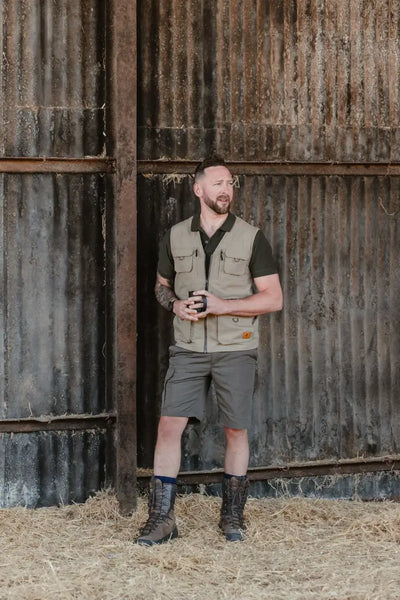 Man in outdoor attire wearing New Forest Trail Shorts perfect for forest trail adventures
