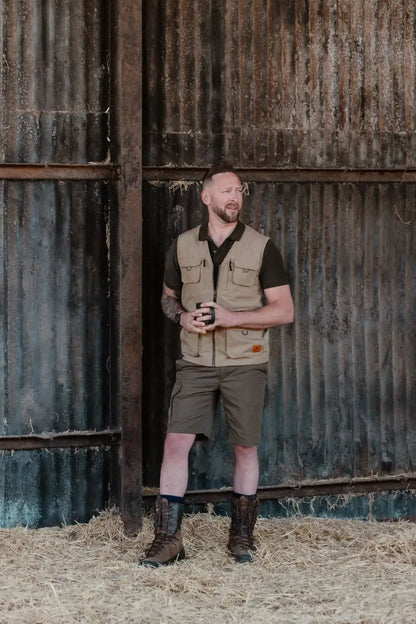 Man in outdoor attire wearing New Forest Trail Shorts for forest trail adventures