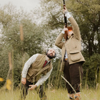 Brown leather hunting rifle on english-made tweed gilet