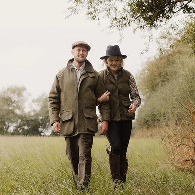 English made tweed jacket in olive green waxed canvas with flat cap and boots