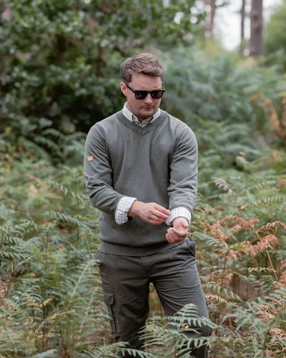 Man in matching forest v-neck jumper and pants, wearing the New Forest V-Neck Jumper