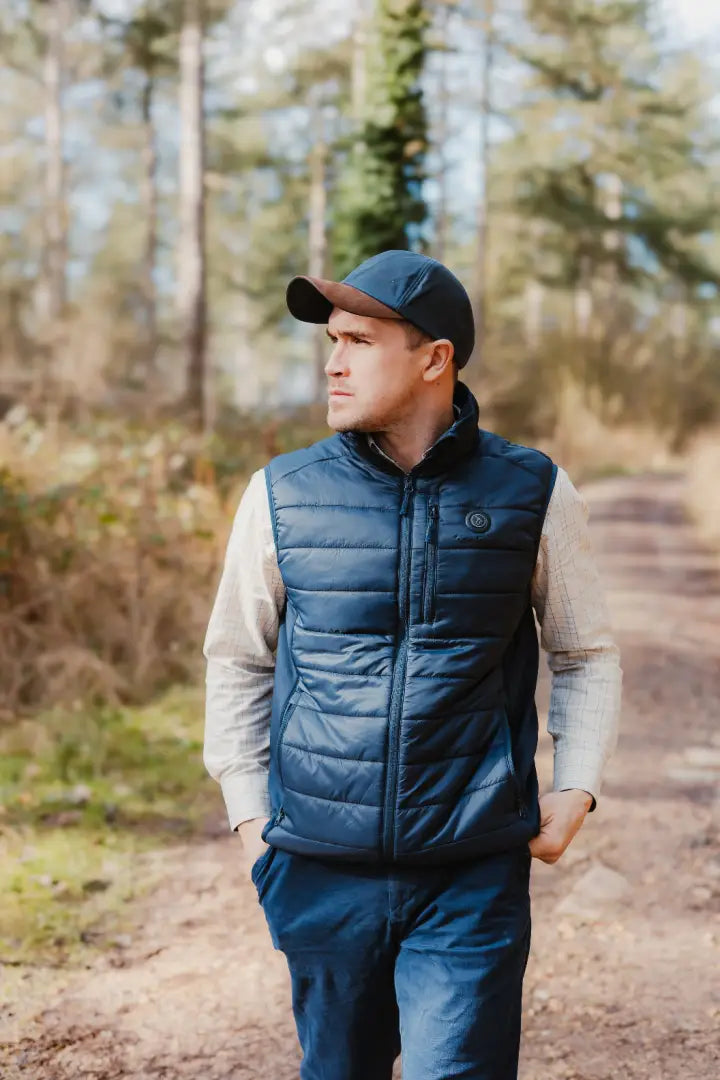 Man in navy puffer vest wearing a stylish wax baseball cap for a cool look