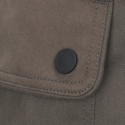 Olive-green fabric pocket with dark button on New Forest Winter Woodland Trousers