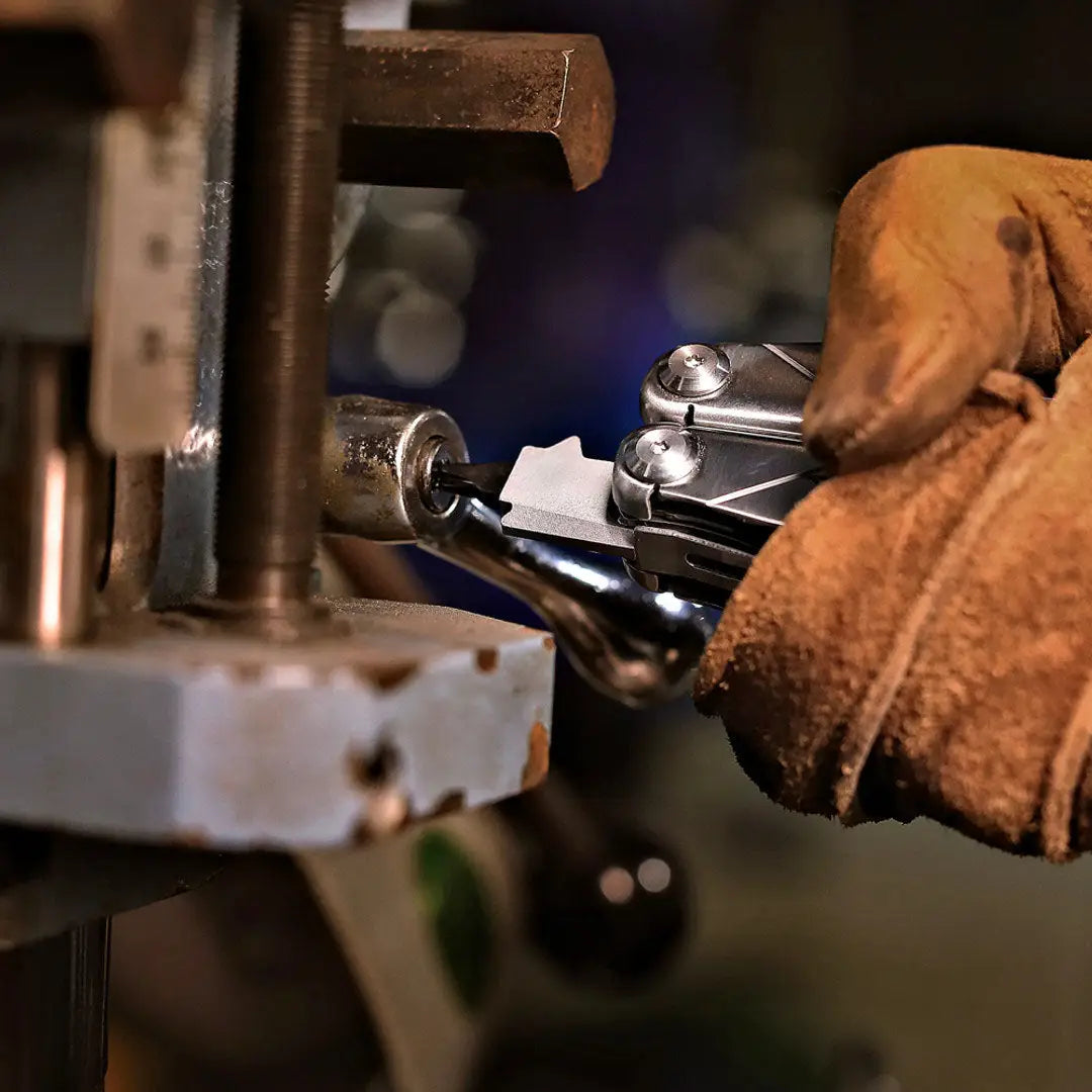 NexTool Flagship Captain multi tool with chrome wrench, brown leather gloves, metal clamp