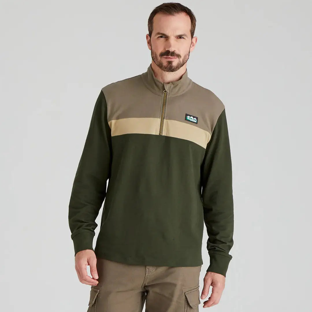 Man wearing a color-blocked Ridgeline Backslider Rugby Top, perfect for Ridgeline mens country clothing