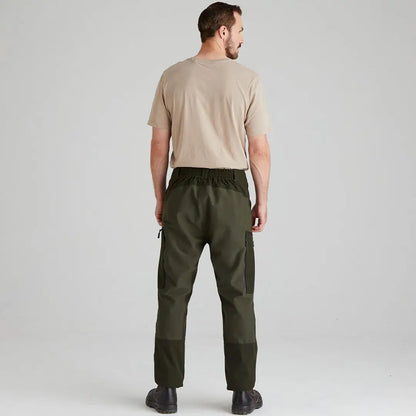 Man in khaki T-shirt and green cargo pants showcasing Ridgeline Cambrian Trousers for all-day wear in worst weather
