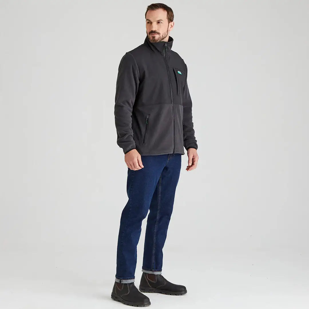 Man wearing a Ridgeline Hybrid Fleece Jacket in dark gray for outdoor adventures