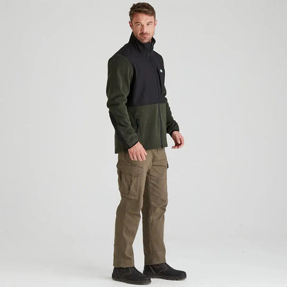 Man in Ridgeline Hybrid Fleece Jacket with cargo pants, stylish outdoor look