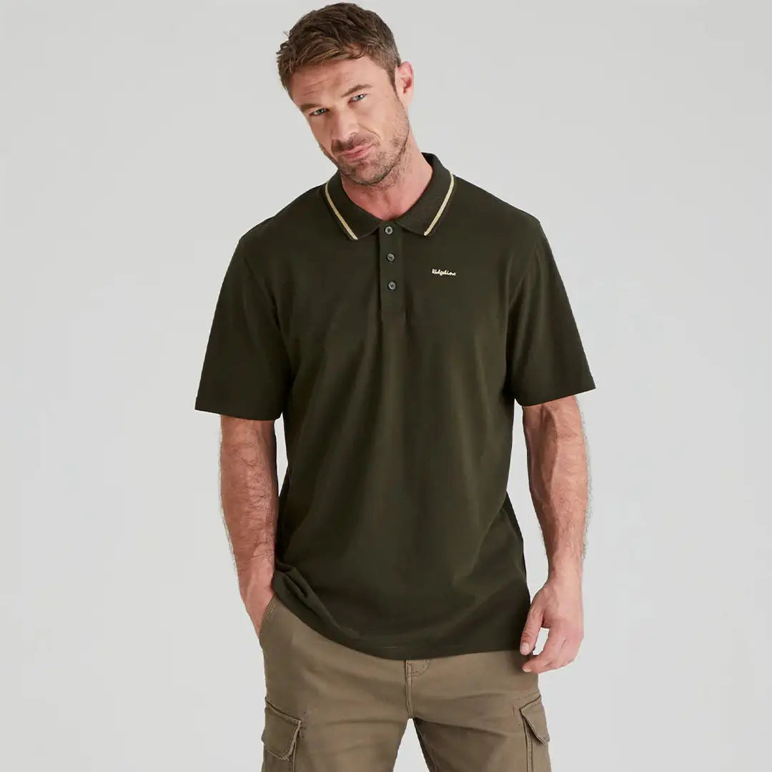 Man in green Ridgeline Kilworth Polo Top showing casual style