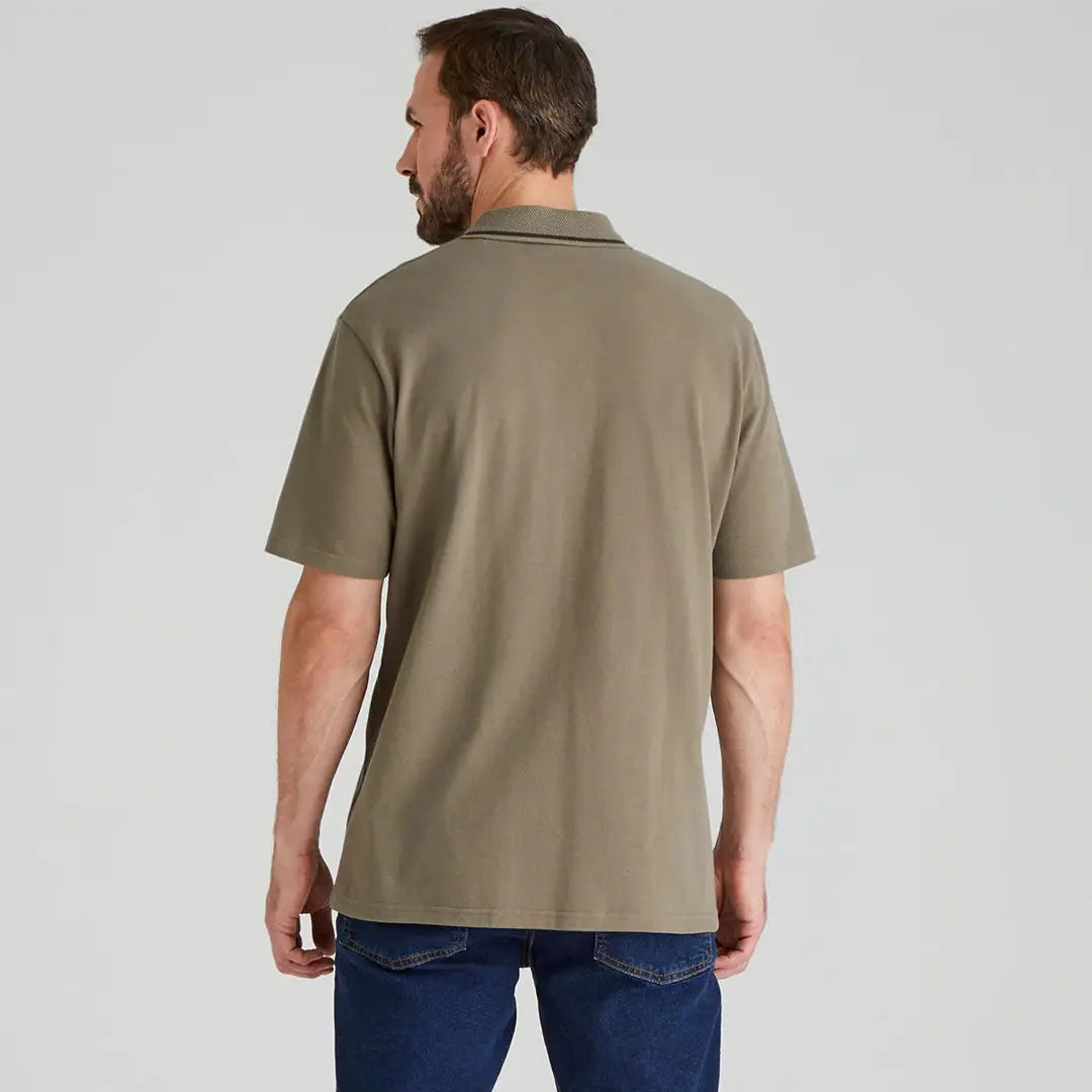 Man wearing Ridgeline Kilworth Polo Top in olive showing stylish kilworth polo vibe