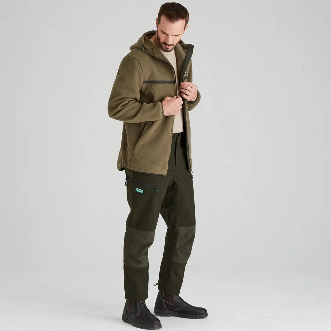 Man in olive Ridgeline Kodiak Fleece Jacket with southern star pro fleece tech