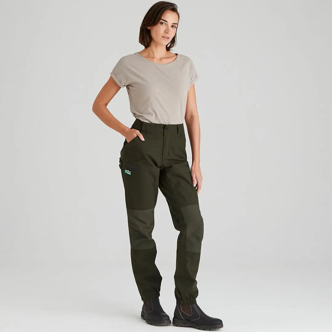 Woman in olive green Ridgeline Ladies Cambrian Trousers for all-day wear in worst weather