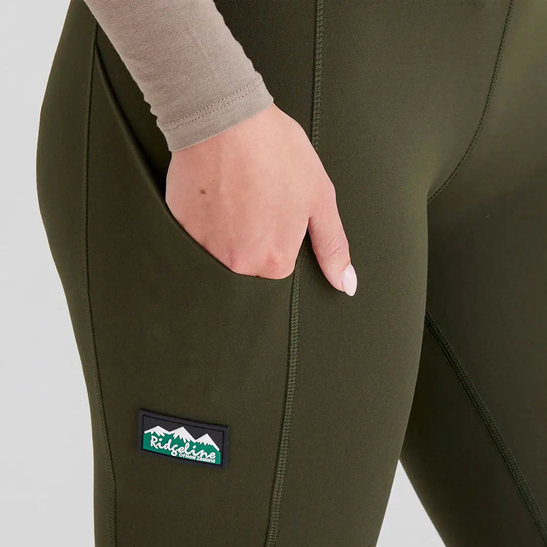 Olive green Ridgeline Ladies Infinity Leggings with side pocket and brushed finish add versatility