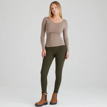 Woman wearing Ridgeline Ladies Infinity Leggings with a brushed finish that provide versatility