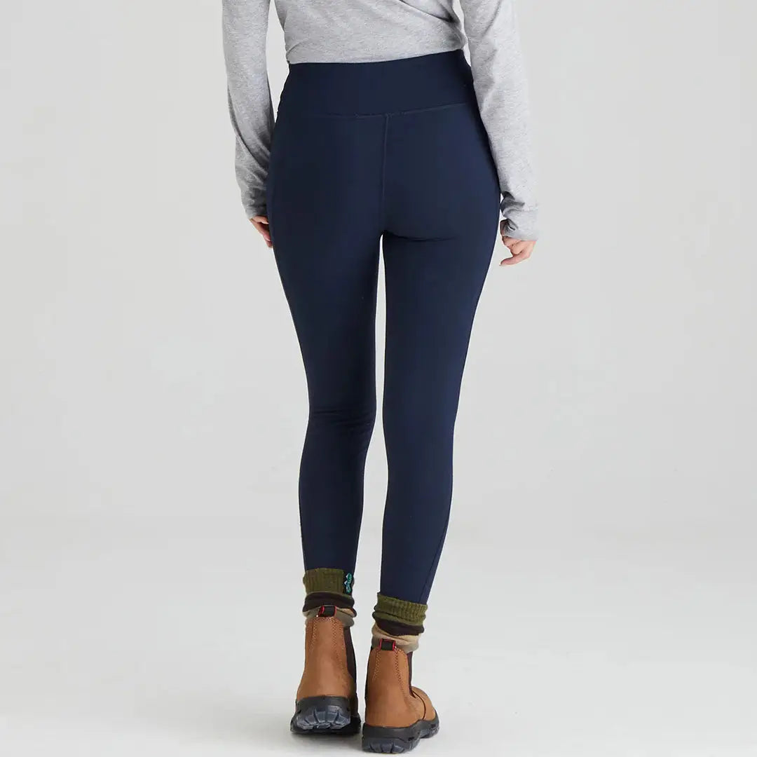 Navy Ridgeline Ladies Infinity Leggings with stylish brown boots for a chic look