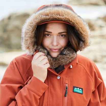 Orange winter parka with fur-trimmed hood from Ridgeline Ladies Monsoon Nordic Jacket collection