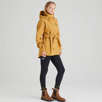 Woman wearing mustard-colored Ridgeline Ladies Monsoon Nordic Jacket, stylish nordic jacket