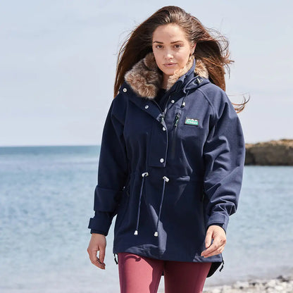 Navy parka with fur-trimmed hood on Ridgeline Ladies Monsoon Nordic Smock for chilly days