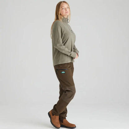 Woman wearing Ridgeline Ladies Narvik Fleece in olive green with brown pants and boots