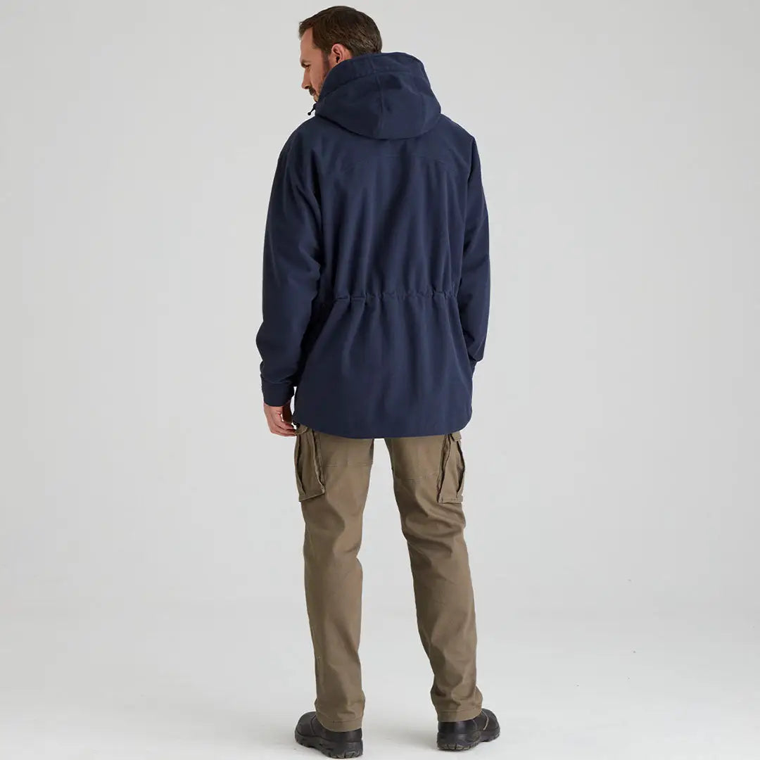 Man wearing navy Ridgeline Torrent III Jacket and khaki cargo pants for country clothing