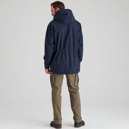 Man wearing navy Ridgeline Torrent III Jacket and khaki cargo pants for country clothing