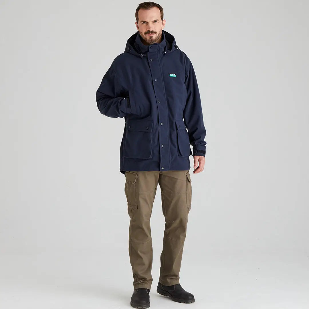 Man wearing Ridgeline Torrent III jacket and cargo pants in country clothing style