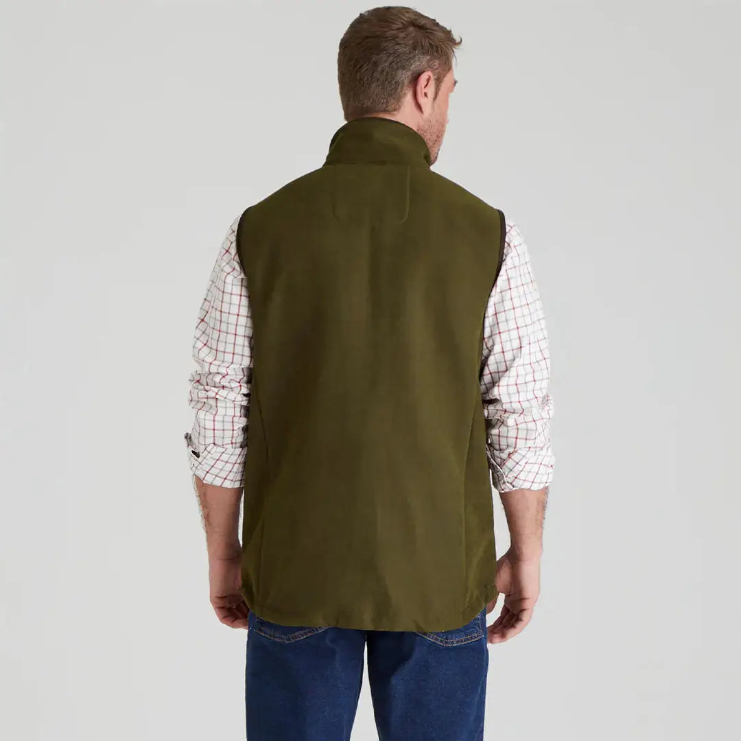 Olive green Ridgeline Monarch Gilet displayed on a model for outdoor adventures