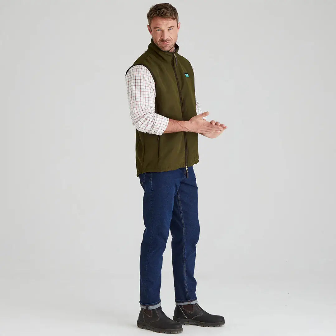 Man wearing olive green Ridgeline Monarch Gilet showcasing style and comfort