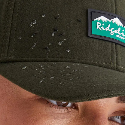 Dark green Ridgeline Monsoon Classic Cap with textured fleece and mountain patch